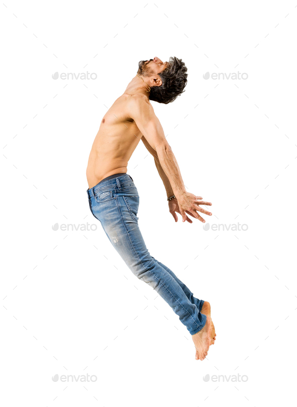 Fit man with bare chest leaping on white background Stock Photo by